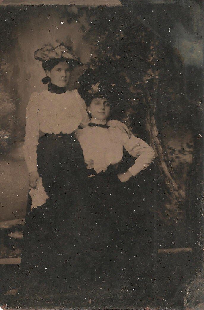 Black and white photo of two women circa 1900